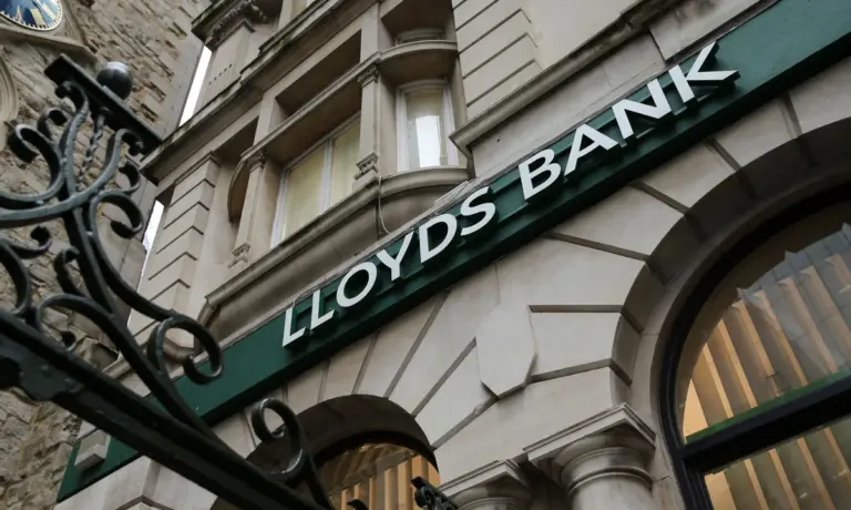 Lloyds profit dips on £800m car loan scandal charge